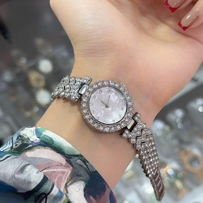 ساعت مچی زنانه دخترانه بند نگین دار طلایی نقره ای رزگلد