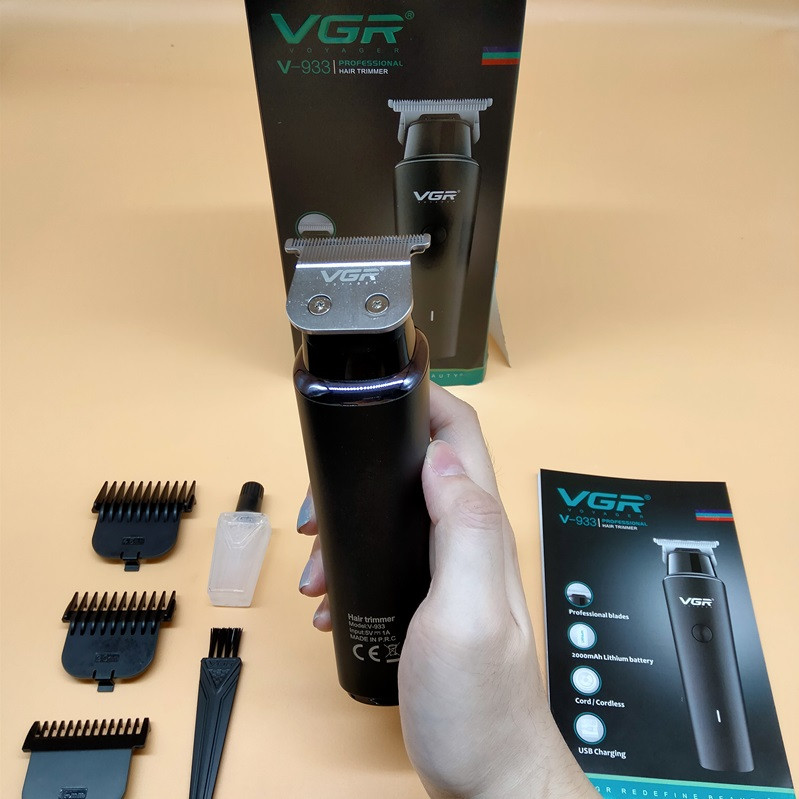 ماشین اصلاح موی سر و صورت وی جی ار مدل V-933 با تیغه استیل پیشرفته، اصلاح خط زن و حجم زن، قابلیت استفاده خشک و مرطوب، باتری قابل شارژ با 500 دقیقه کارکرد و چهار شانه تنظیم اندازه اصلاح 0.5 تا 2 میلیمتر