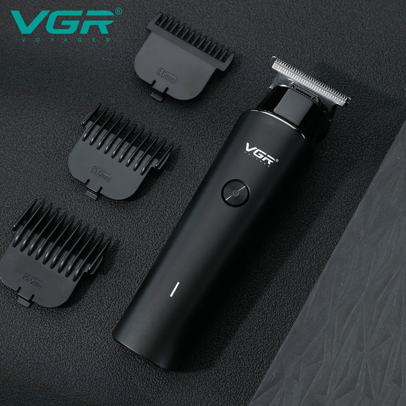 ماشین اصلاح موی سر و صورت وی جی ار مدل V-933 با تیغه استیل پیشرفته، اصلاح خط زن و حجم زن، قابلیت استفاده خشک و مرطوب، باتری قابل شارژ با 500 دقیقه کارکرد و چهار شانه تنظیم اندازه اصلاح 0.5 تا 2 میلیمتر