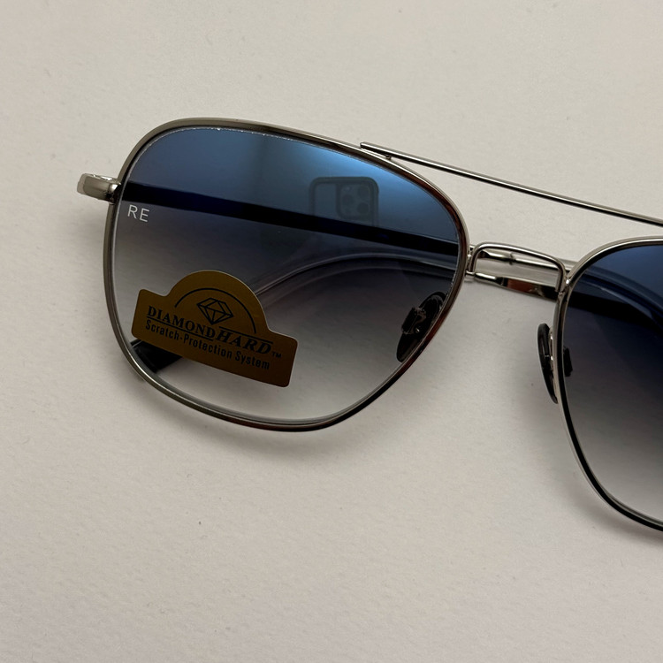 عینک آفتابی خلبانی رندولف شیشه سنگ آنتی رفلکس آبی هایلایت نقره ای فول پک RANDOLPH AVIATOR RE 58 24K WHITE GOLD
