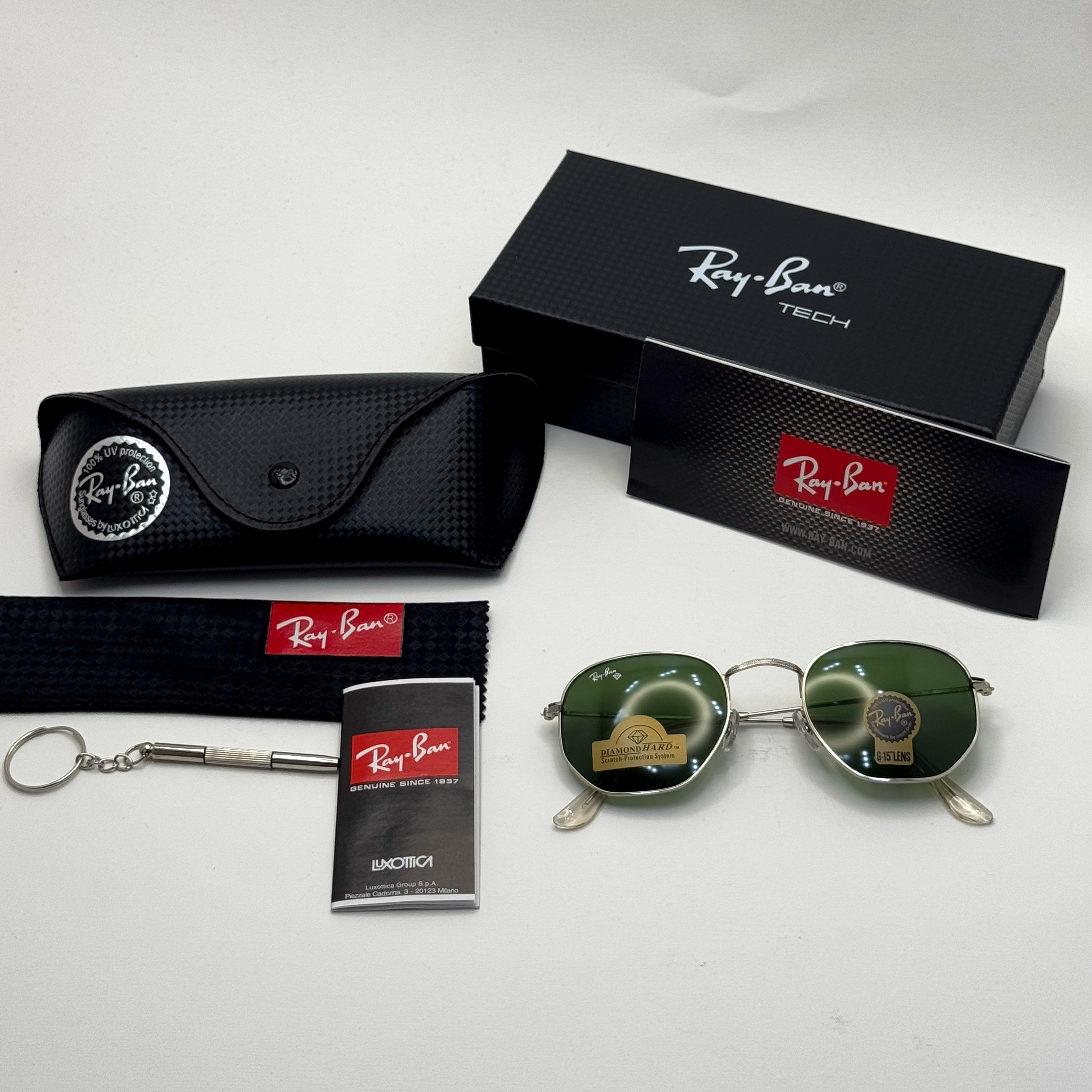 عینک ریبن هگزونال شیشه سنگ سبز فریم نقره ای به همراه پک کامل ریبن کد Rayban RB 3548