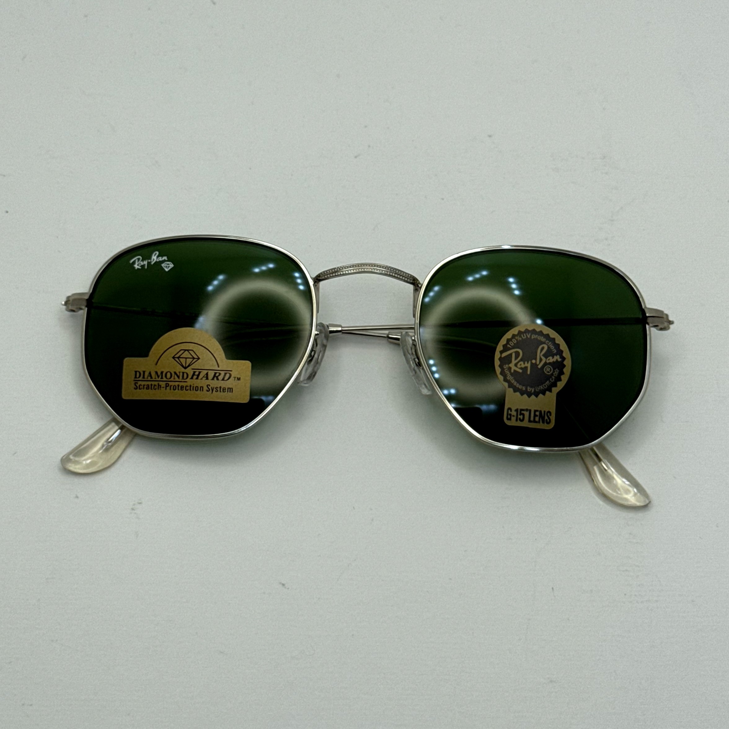 عینک ریبن هگزونال شیشه سنگ سبز فریم نقره ای به همراه پک کامل ریبن کد Rayban RB 3548