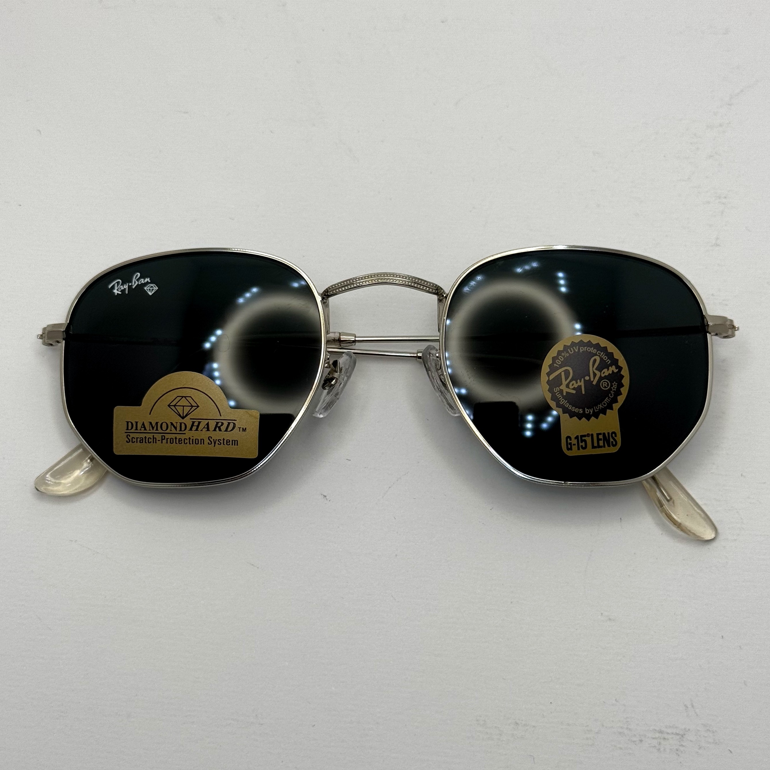 عینک ریبن هگزونال شیشه سنگ مشکی فریم نقره ای به همراه پک کامل ریبن کد Rayban RB 3548