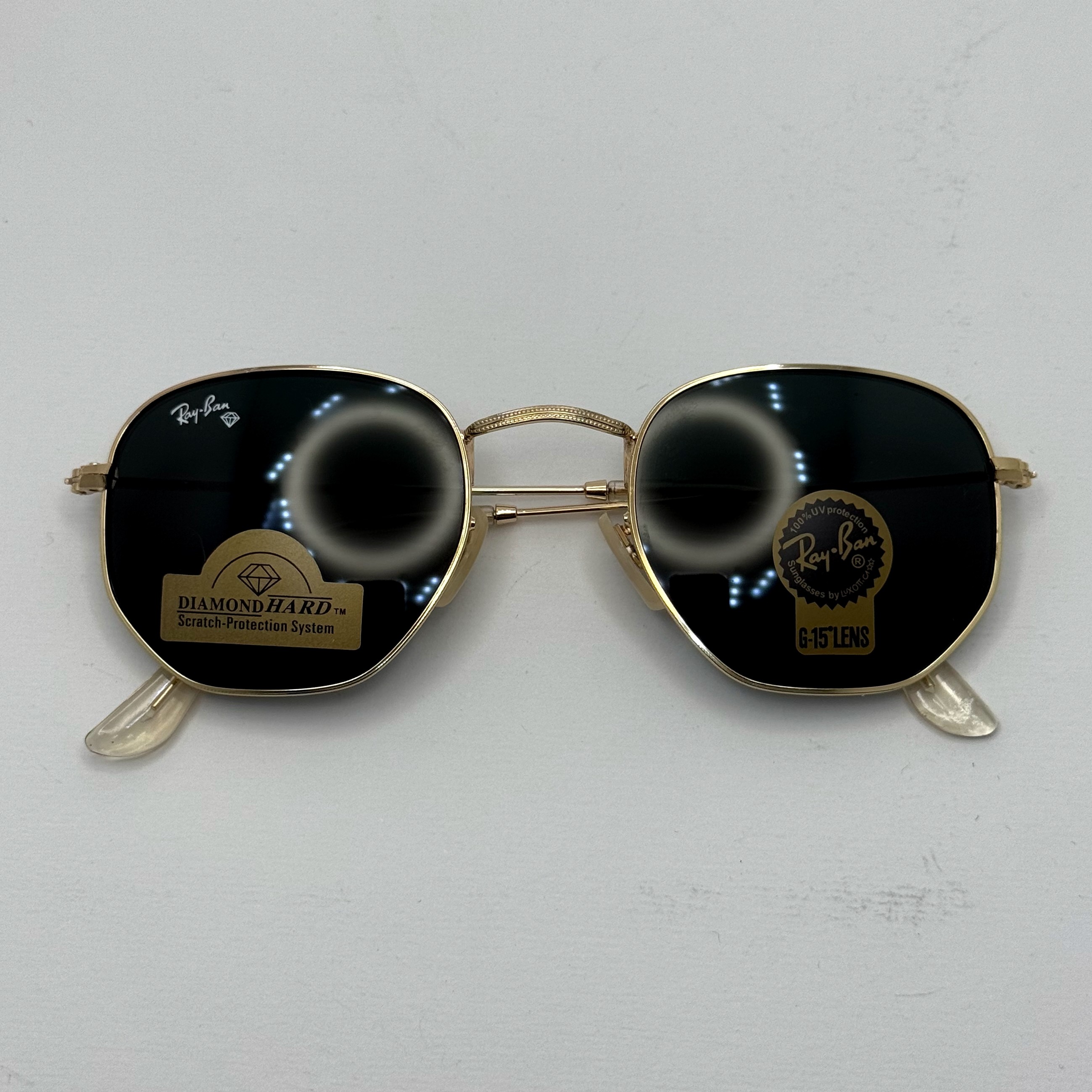 عینک ریبن هگزونال شیشه سنگ مشکی فریم طلایی به همراه پک کامل ریبن کد Rayban RB 3548