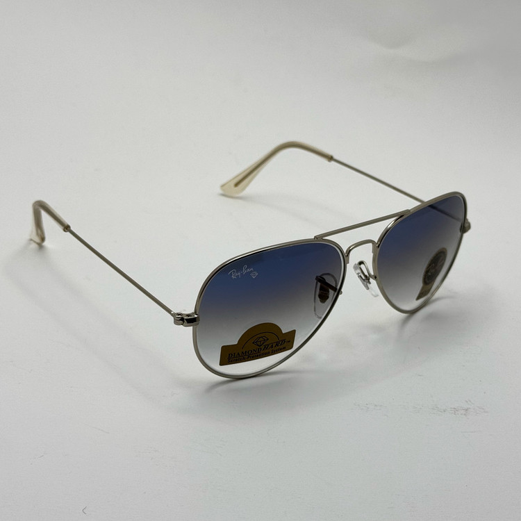 عینک ریبن خلبانی شیشه سنگ آبی هایلایت فریم نقره ای به همراه پک کامل ریبن کد Rayban RB 3025