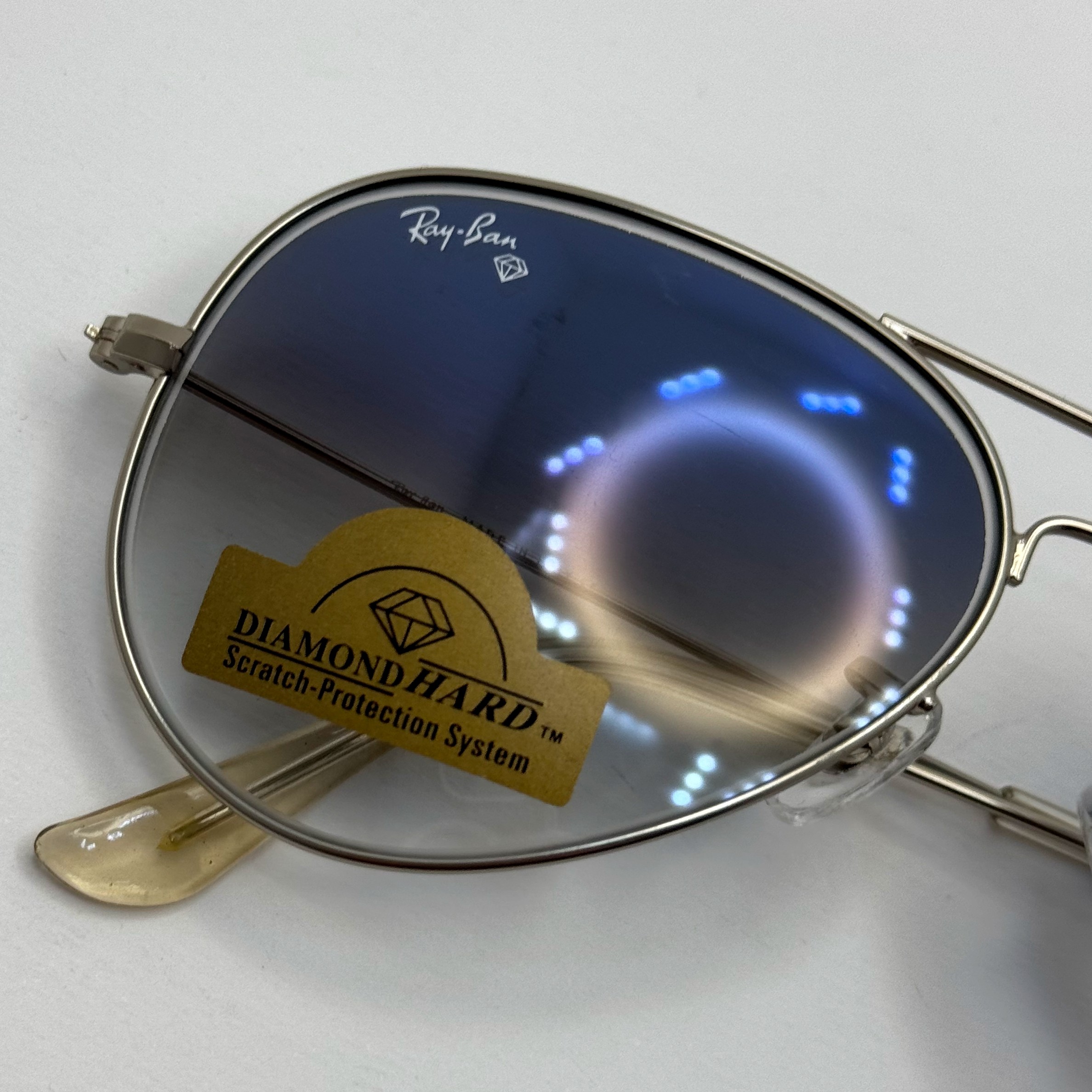 عینک ریبن خلبانی شیشه سنگ آبی هایلایت فریم نقره ای به همراه پک کامل ریبن Rayban RB 3025