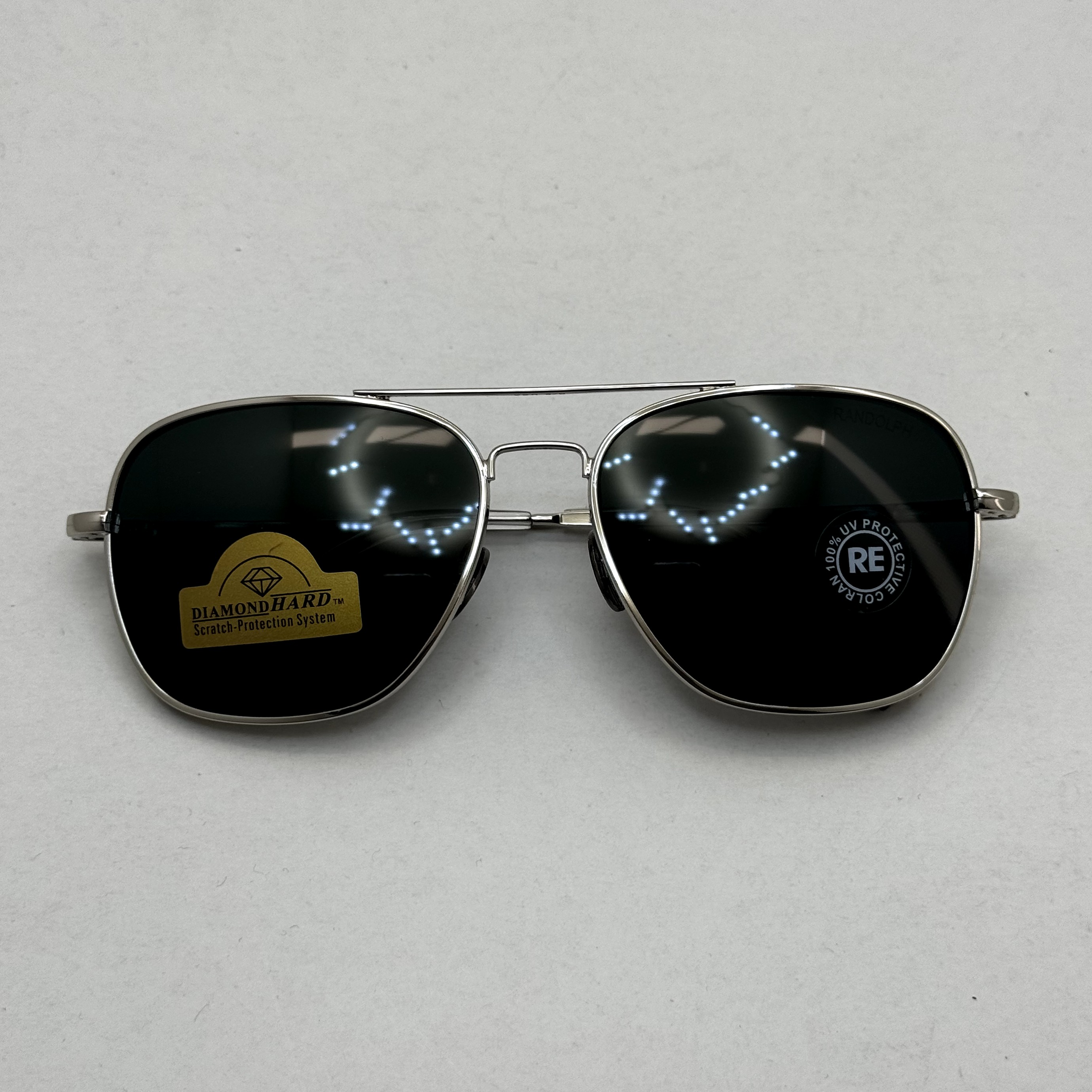 عینک آفتابی خلبانی رندولف شیشه سنگ آنتی رفلکس مشکی فریم نقره ای فول پک RANDOLPH AVIATOR RE 58 WHITE GOLD