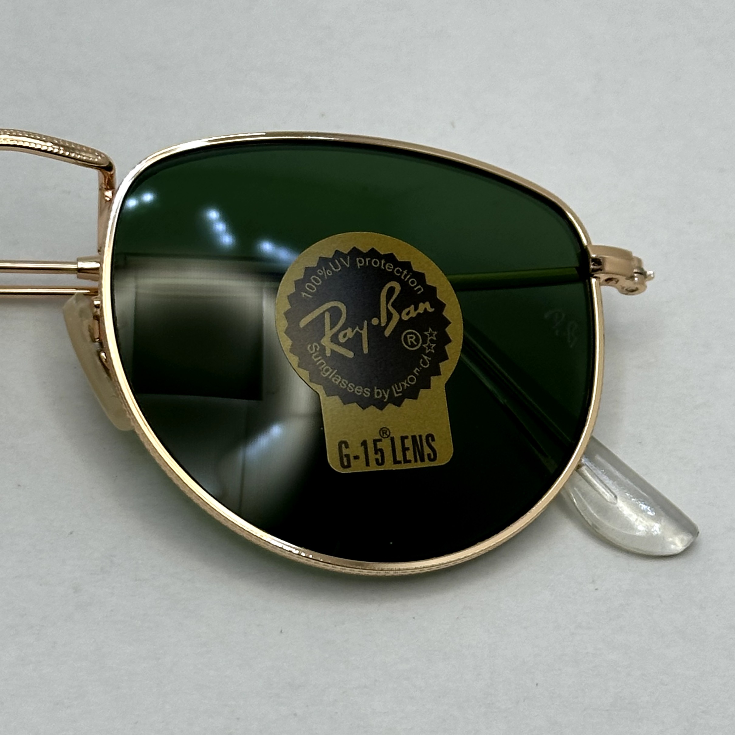 عینک آفتابی ریبن rayban شیشه سنگ سبز طلایی کد rb 3958 - فول پک