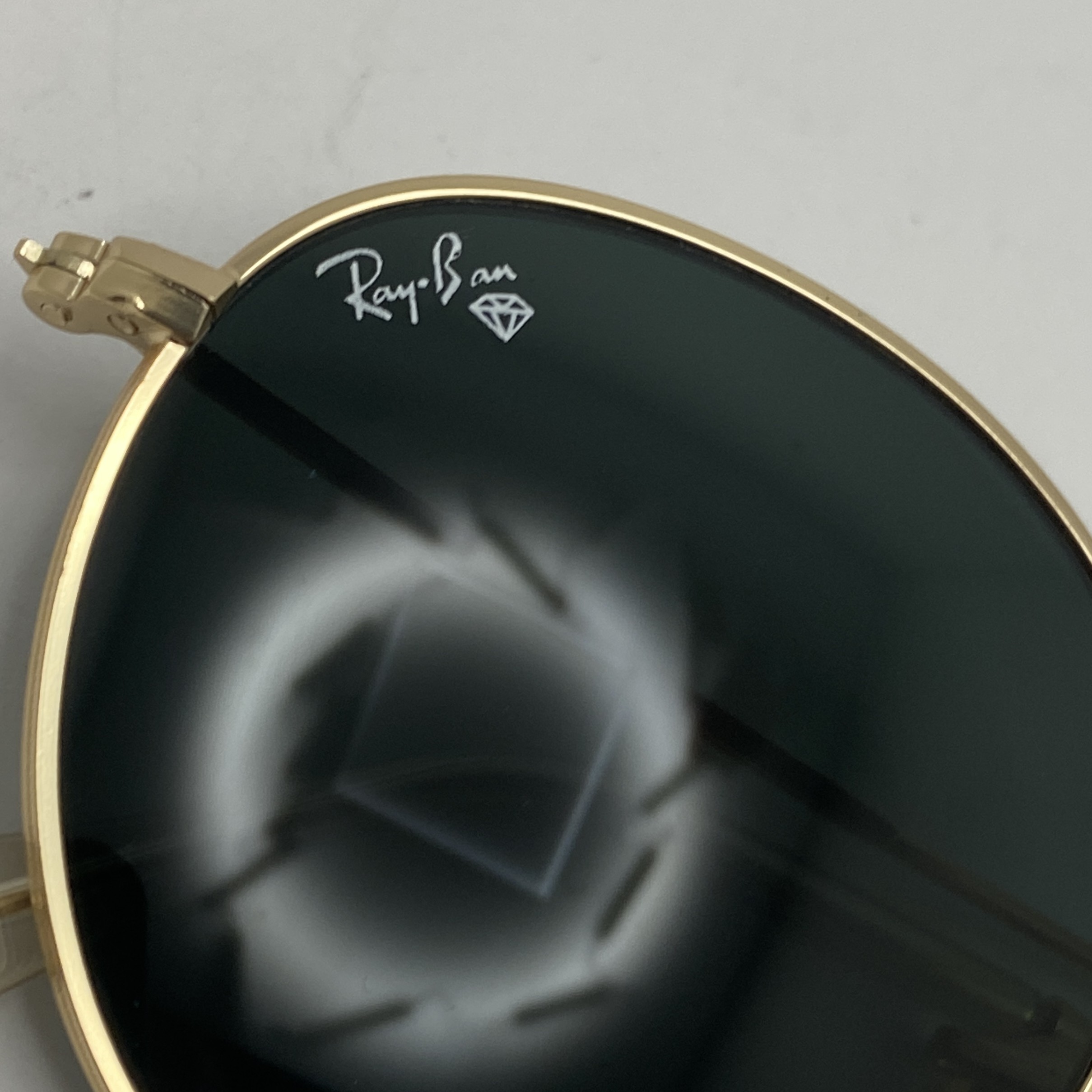 عینک آفتابی ریبن rayban گرد مشکی طلایی شیشه سنگ RB 3447
