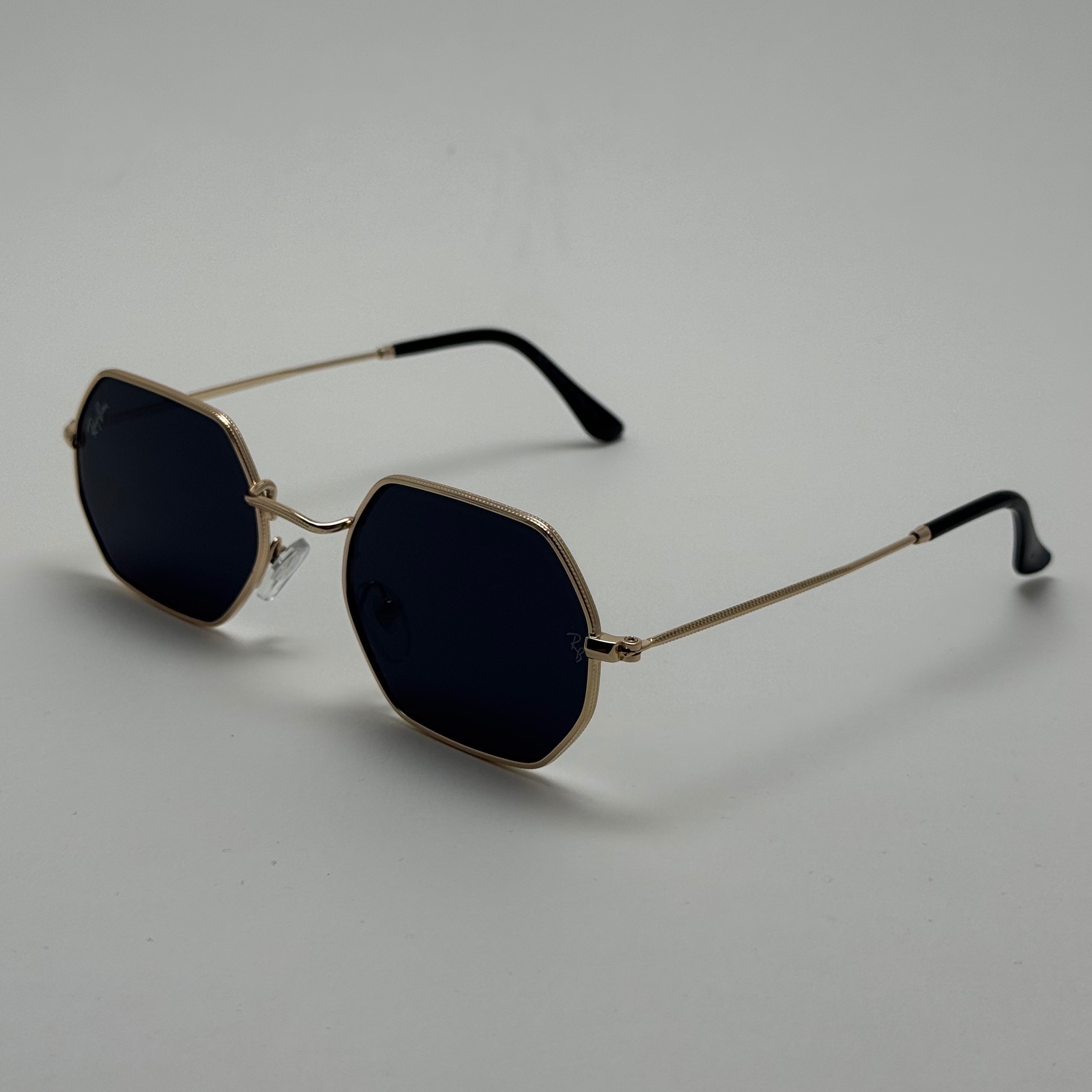 عینک آفتابی ریبن Ray-ban شش ضلعی مشکی طلایی سبک کد RB 3556