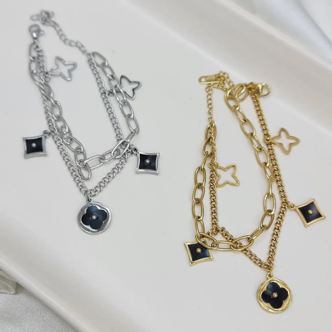 دستبند زنانه دولاین با پلاک ونکلیف Vancleef رنگ طلایی و نقره ای آبکاری نقره رنگ ثابت کد zgg