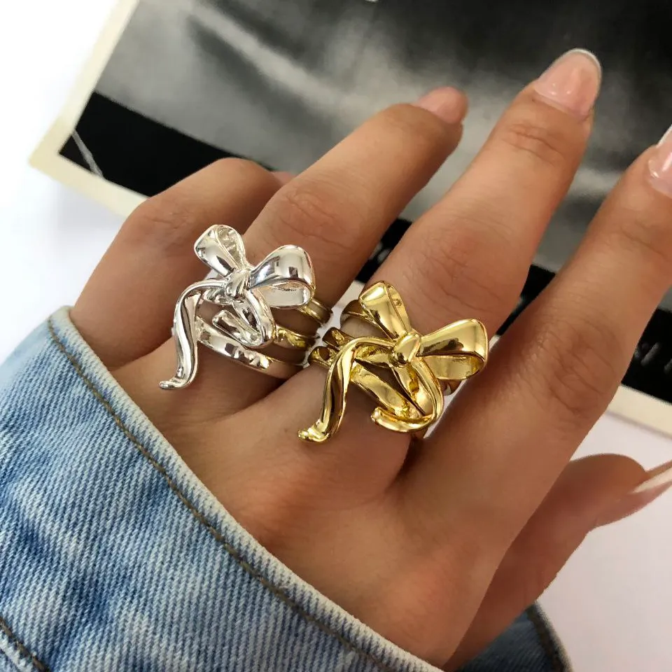 انگشتر زنانه چند لاین پاپیونی رنگ طلایی و نقره ای آبکاری نقره رنگ ثابت فری سایز Freesize کد zsm (پس کرایه)