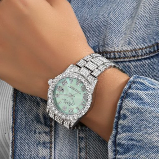ساعت مچی زنانه طرح رولکس Rolex قفل پروانه ای فول نگین کار شده سیلور تقویم دار رنگ ثابت کد zmp (پس کرایه)
