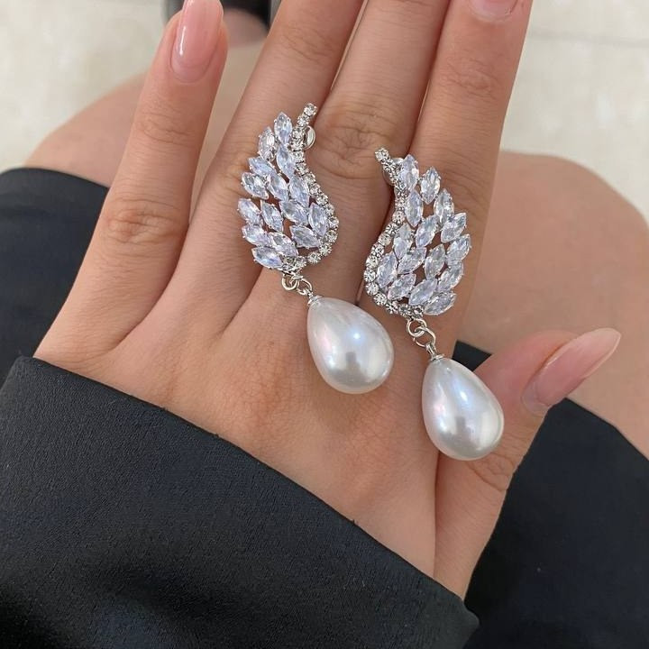 گوشواره زنانه طرح پاپیون نگین و مروارید تنوع طرح رنگ کاملا ثابت کد tj (پس کرایه)