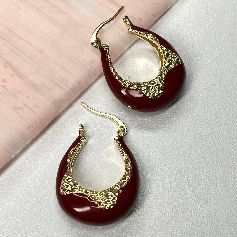 گوشواره طرح جواهری (میخ نقره) طرح زرشکی طلایی تنوع طرح رنگ ثابت کد tk (پس کرایه)