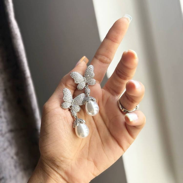 گوشواره طرح جواهری طرح پروانه فول نگین مروارید رنگ ثابت کد sm (پس کرایه)