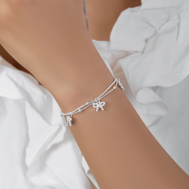 دستبند آبکاری نقره زنانه طرح آویز پاپیون و گوی دو لاین تنوع طرح رنگ ثابت کد mp