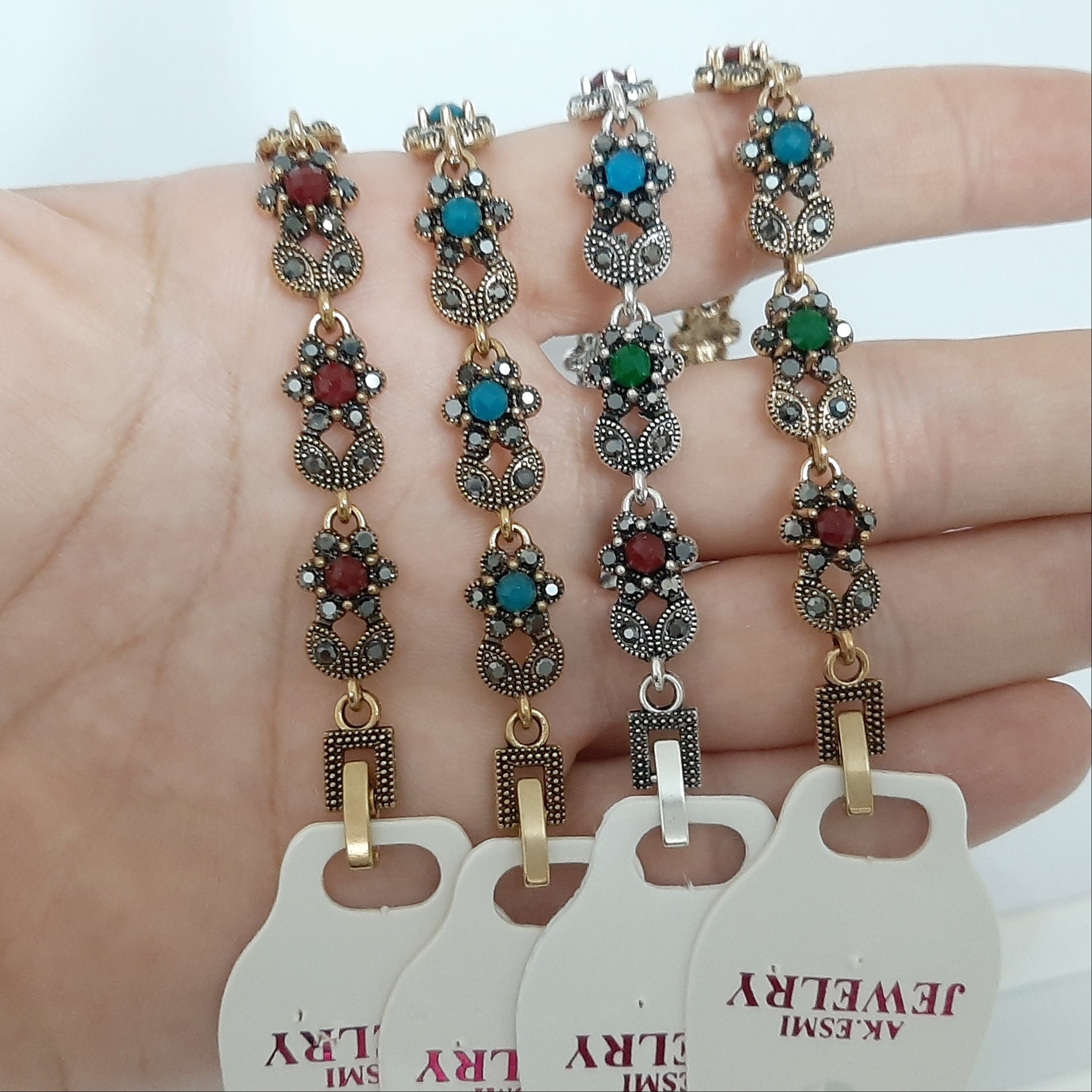 دستبند سیاه قلم کاملا رنگ ثابت با نگین فیروزه و عقیق ورق بزنید لطفا