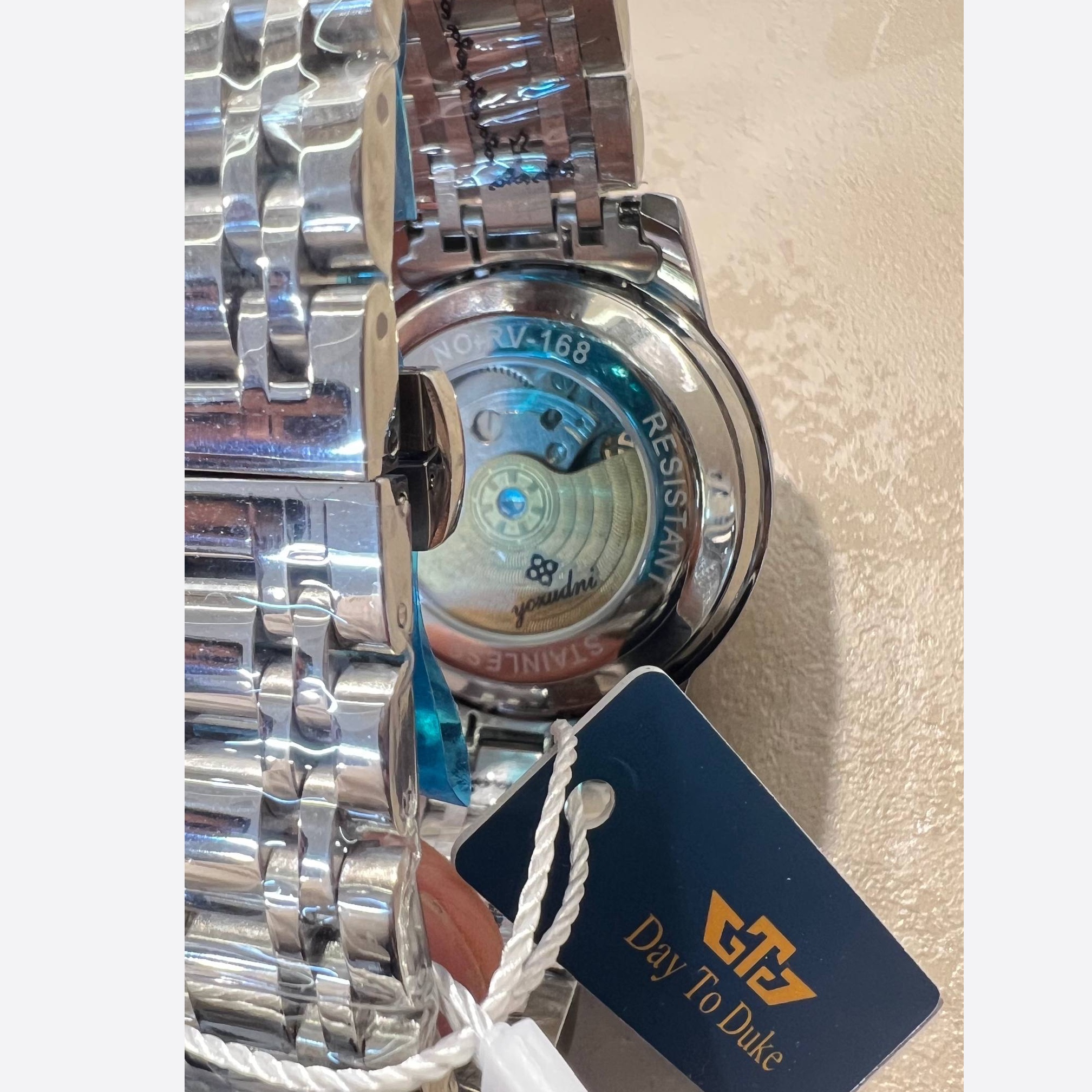 ساعت اتوماتیک کوکی لاکچری شرکتی DayToDuke برند یوزودنی فول پک جعبه کارت گارانتی بند اضافه و پین درآر و پاکت و ...