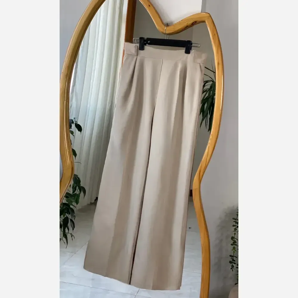 شلوار بگ زنانه جنس تنسل میله ای خنک و سبک در 4 رنگ متنوع سایز 44 تا 50