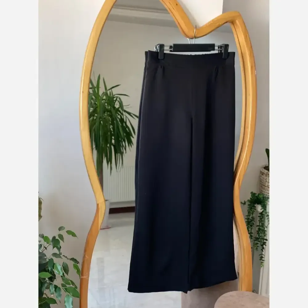 شلوار بگ زنانه پارچه مازراتی مشکی قد 100 سایز L تا 2XL